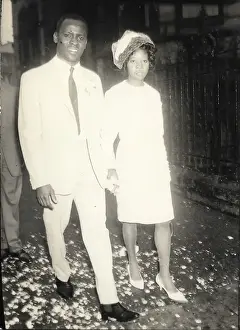 Confetti Prints: Bride and Groom holding hands in Nottingham