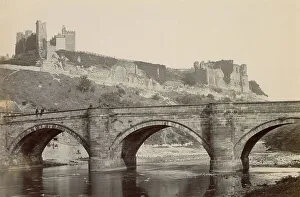 Crenellated Prints: Bridge over a river, with ruined castle above, North Wales Date: circa 1889