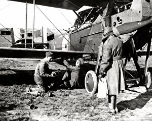 Arming Collection: British airmen arming a plane with bombs, WW1