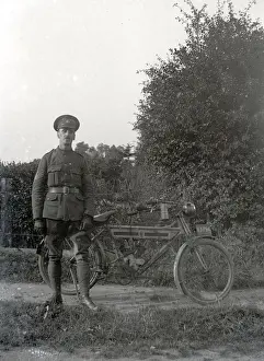 British Army Staff Sergeant, posing with his Royal Enfield motorcycle