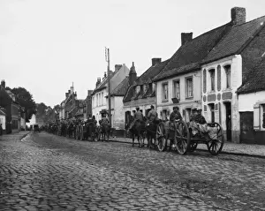 British artillery driving through Vieux Berquin, France, WW1