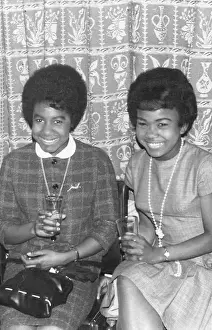 Nottingham Prints: Two British Caribbean ladies in Mod outfits having a drink