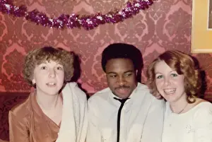 British Caribbean man and English girls at work christmas pa