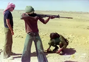 British Caribbean man with riffle in Oman