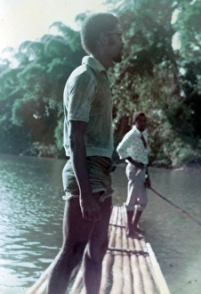 Images Dated 19th July 2016: British Caribbean man standing on raft on the Rio Grande, Jam