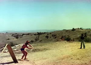 British Caribbean and white men playing cricket in Oman