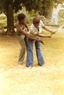 Instructor Prints: British Caribbean woman having golf lessions - Jamaica