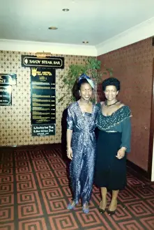 Steak Prints: Two British Caribbean women standing in a restaurant in Nott