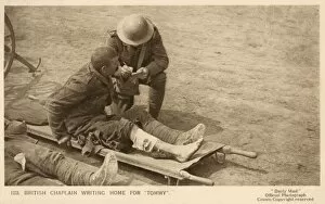 Images Dated 21st February 2011: British Chaplain writes for a wounded soldier