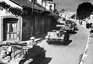 Armoured Prints: British machine gun carriers passing through French village