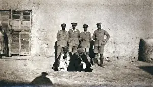 British officers and arabs outside a building, Middle East