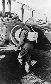 British pilot getting into his plane, WW1