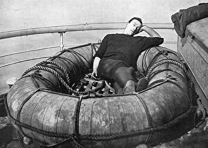 Buoy Collection: British sailor snoozing on deck, WW1
