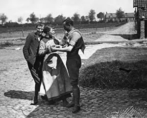 British soldier chatting to local woman, Flanders, WW1