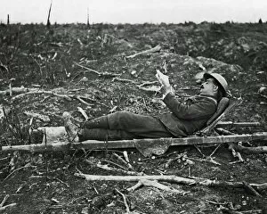 Images Dated 29th January 2009: British soldier relaxing on a stretcher, Somme, WW1