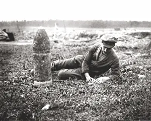 British soldier writing home next to bombshell, WW1