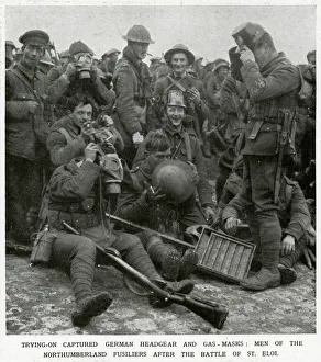 Images Dated 27th November 2017: British soldiers trying on captured German headgear 1916
