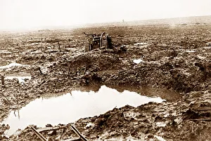 A British tank in mud and shell holes during WW1