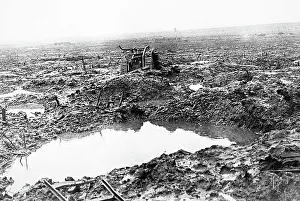 A British tank in mud and shell holes during WW1