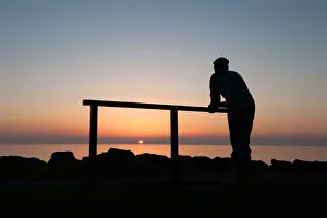 Bronze statue of fisherman watching the sunset, Port William Bronze statue of fisherman watching the sunset, Port William