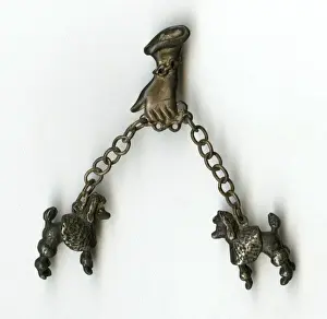 Brooch -- hand taking two poodles for a walk