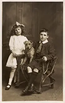 Starched Prints: A Brother and Sister posing with their pet dog