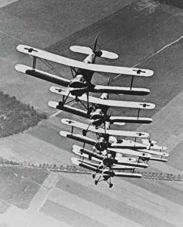Trainer Collection: Bucker Bu 133 Jungmeister- a tight 7 plane fomation, go