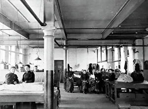 Burling and mending pieces in a woollen mill in Bradford