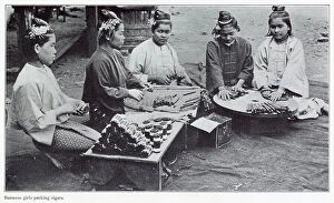Burma Collection: Burmese women rolling leaf tobacco into cigars. Date: 1908