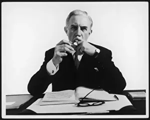 Business Man Prints: Businessman Lights Cigar