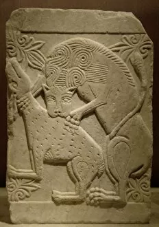 Byzantine relief. Marble slab with a lion devouring a deer