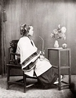 c. 1880s China - Chinese woman in a studio setting
