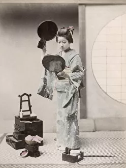 Cosmetics Collection: c. 1880s Japan - geisha with two mirrors