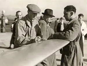 Schlesinger Prints: C W A Scott, left, signs an autograph at Portsmouth