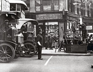 Images Dated 8th February 2021: c.1930s street scene in London with bus and policeman