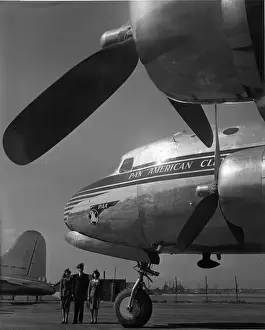 Cabin crew in front of a Douglas DC-4