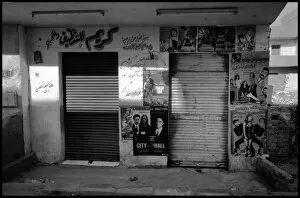 Images Dated 6th October 2015: Cairo, Egypt - Roadside shop with posters graffiti etc