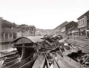 Canal scene with boats, probably Manila, Philippines