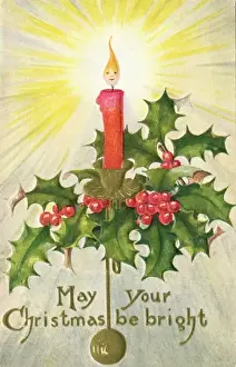 Candle surrounded by holly