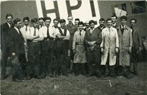 Capt G. T. R. Hill (centre) with a group of mechanics in f?