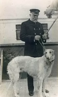 Sank Collection: Captain Smith of the RMS Titanic, with dog