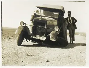 Break Down Prints: Car with broken wheel in the desert, Middle East