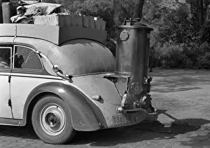 Suitcases Prints: Car with contraption on the back