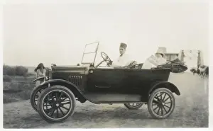 Car with driver, mother and baby, Middle East