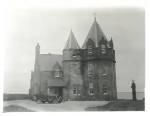 Car outside John O Groats Hotel, Scotland