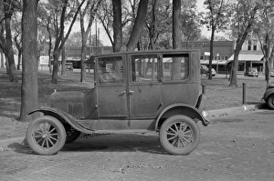 Car parked in front of county courthouse, Yates Center, Kans Car parked in front of county courthouse, Yates Center, Kans