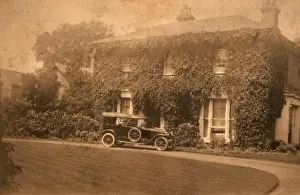Automobilia Prints: Car parked outside detached house with ivy