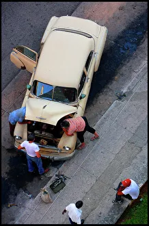 Repairs Prints: Car repairs in street, Havana, Cuba
