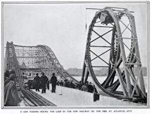 Images Dated 22nd January 2021: A car rushes round the loop at the Switchback on the pier at Atlantic City, America