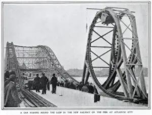 Rollercoaster Prints: A car rushes round the loop at the Switchback on the pier at Atlantic City, America
